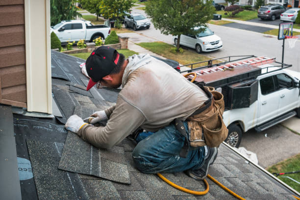Professional Roofing technician working in Kalispell, MT